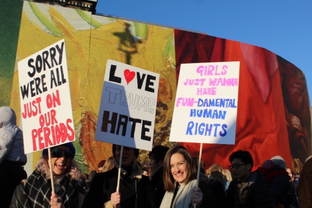 Protesters hold home made placards during Women's March in London on Saturday as part of global day of protests against new US President Donald Trump (MEE/Harriet Hearst)