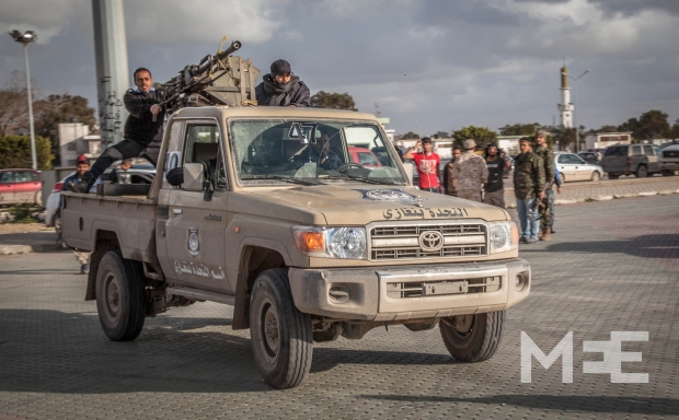 A military vehicle rushes to the area where a rocket landed (MEE/Hassan Morajea)