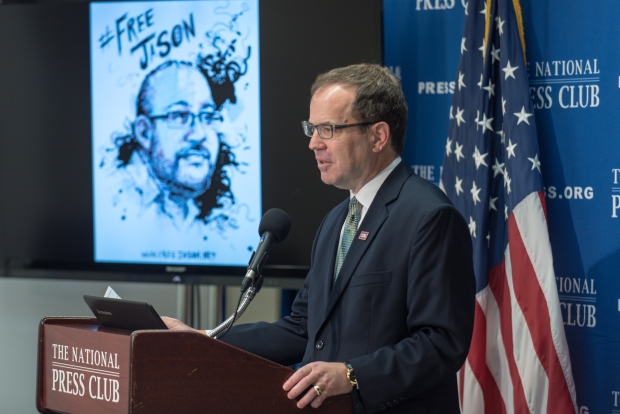 Former National Press Club President John Hughes reads Rezaian's articles as part of a 24-hour campaign calling for his release (MEE/Noel St John/The National Press Club)