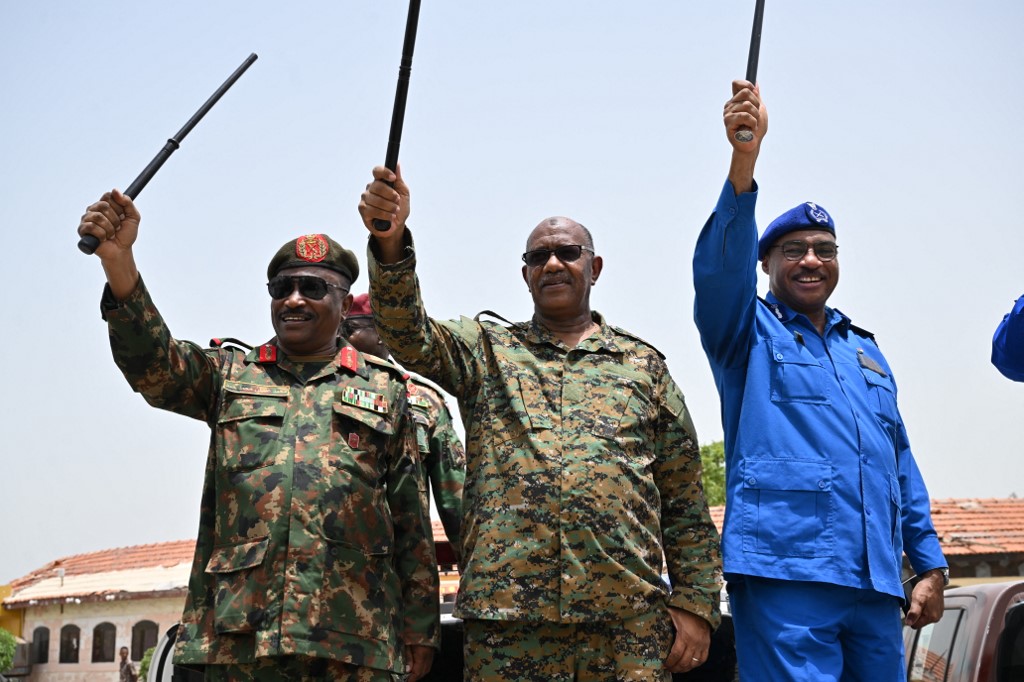 Sudan's Red Sea State Governor Mustafa Mohamed Nour (C) attends a military parade held on the occasion of Army Day outside the Armed Forces Officers' Club in Port Sudan on August 14, 2024.