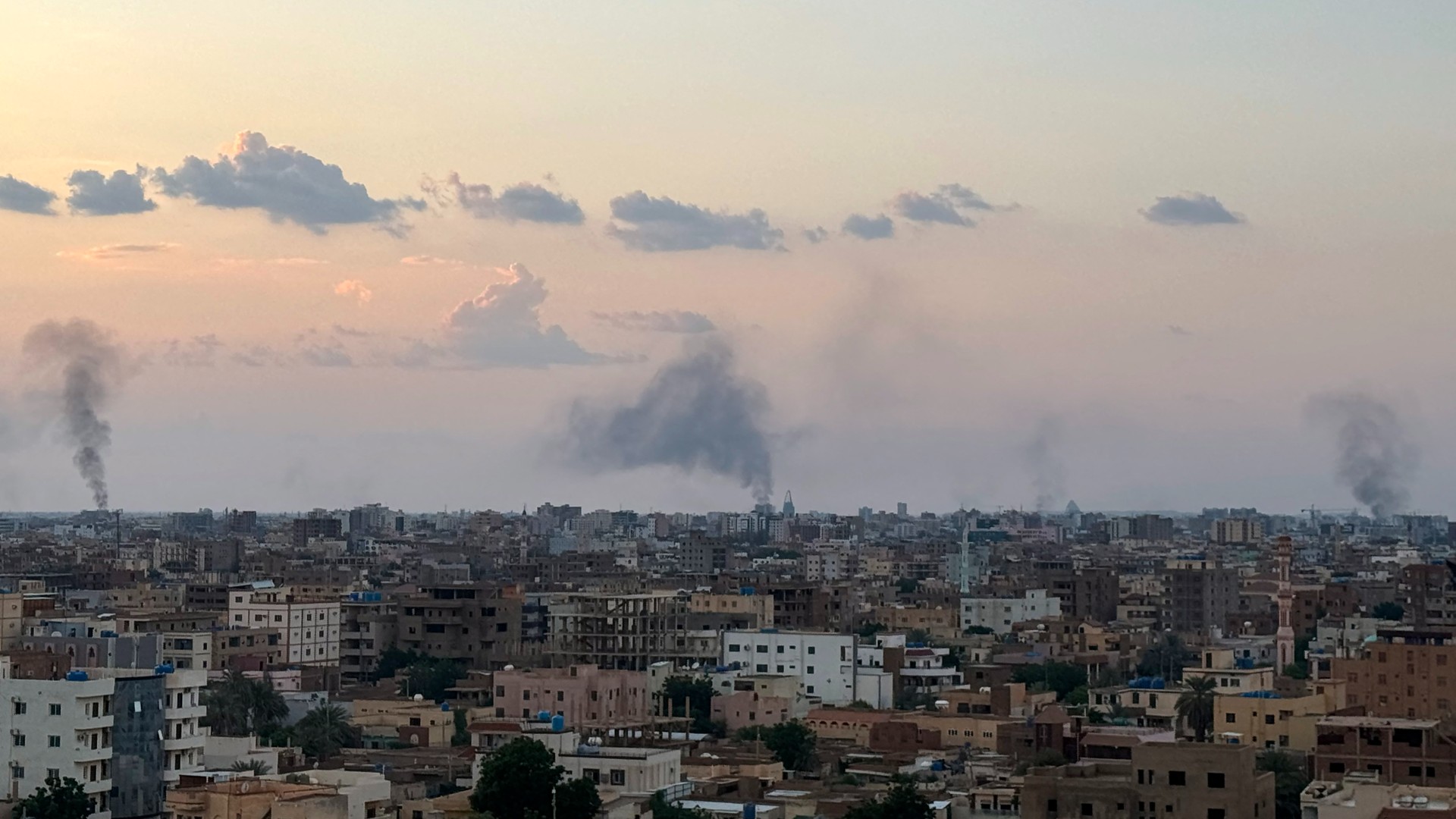 Smoke billows during air strikes in central Khartoum as the Sudanese army attacks positions held by the paramilitary Rapid Support Forces (RSF) throughout the Sudanese capital on October 12, 2024. Fierce fighting has raged since October 11 around Khartoum, much of which is controlled by the RSF, with the military pounding the centre and south of the city from the air.