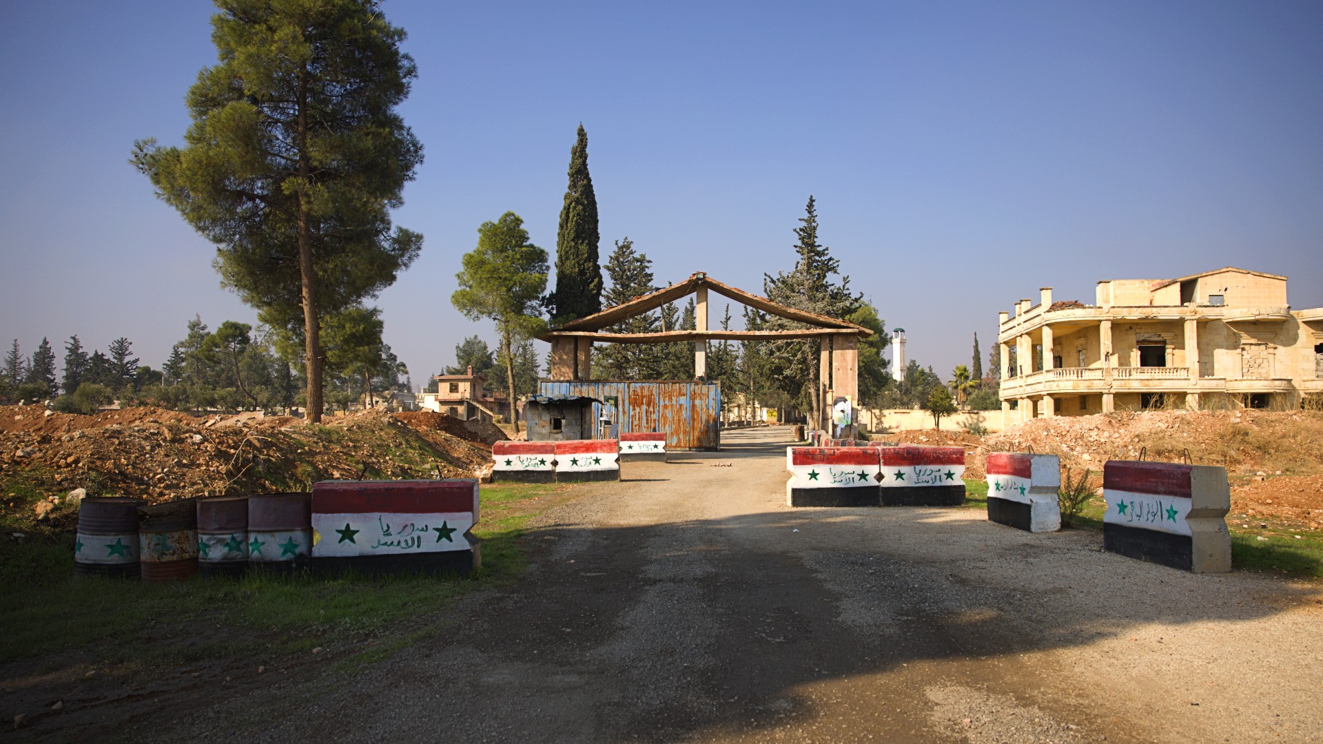 The entrance of a military base near the village of Kafr Jom south of Aleppo, 29 November 2024 (Mohamed Aldaher/MEE) 