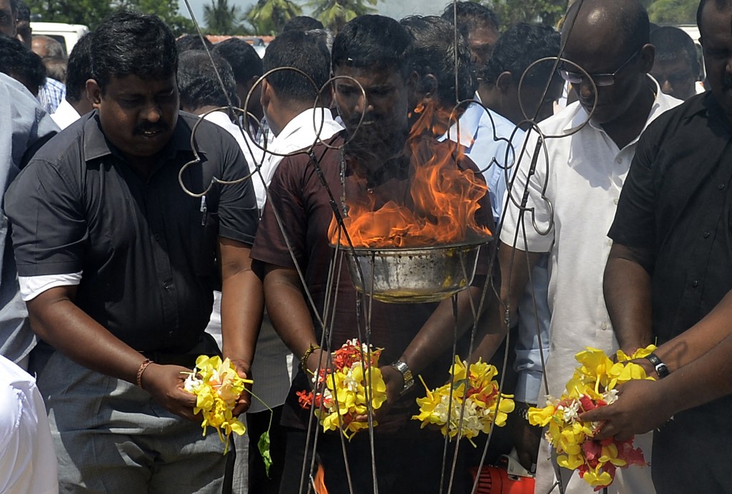 Sri Lankan Tamils hold a ceremony on the outskirts of Jaffna in 2015 (AFP)