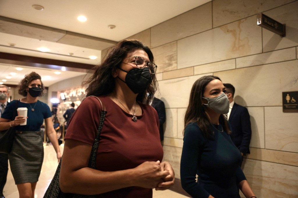  Rep. Rashida Tlaib (D-MI) (L) and Rep. Alexandria Ocasio-Cortez (D-NY) (R) arrive for a briefing with the House of Representatives on the situation in Afghanistan at the U.S. Capitol on August 24, 2021 
