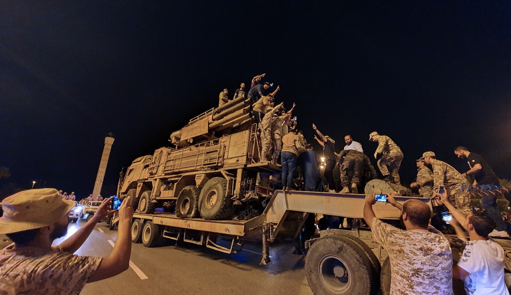 Forces loyal to the GNA parade a Russian-made air defence system truck in Tripoli on 20 May, after its capture at al-Watiya airbase (AFP)