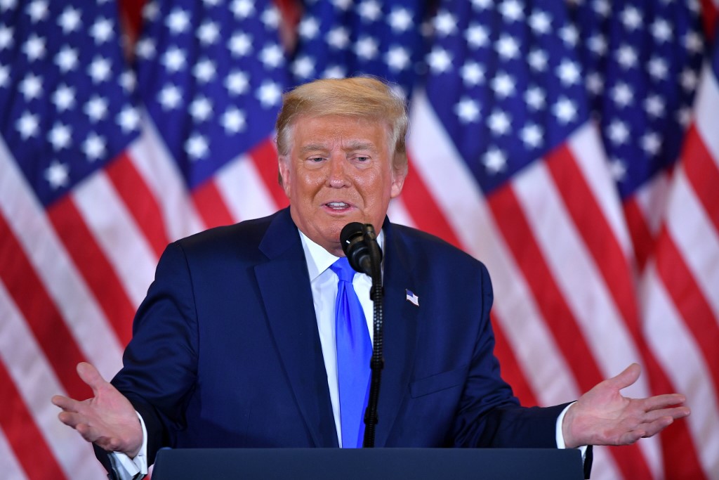 US President Donald Trump speaks in Washington on 4 November (AFP)