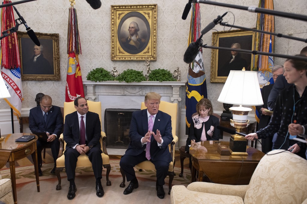 US President Donald Trump meets Egyptian President Abdel Fattah al-Sisi in Washington on 9 April (AFP)