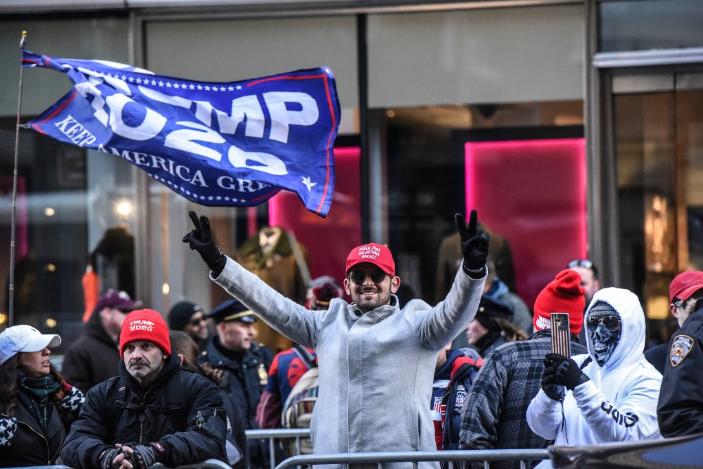 Trump supporters react to anti-fascist protesters in New York on 16 November (AFP)