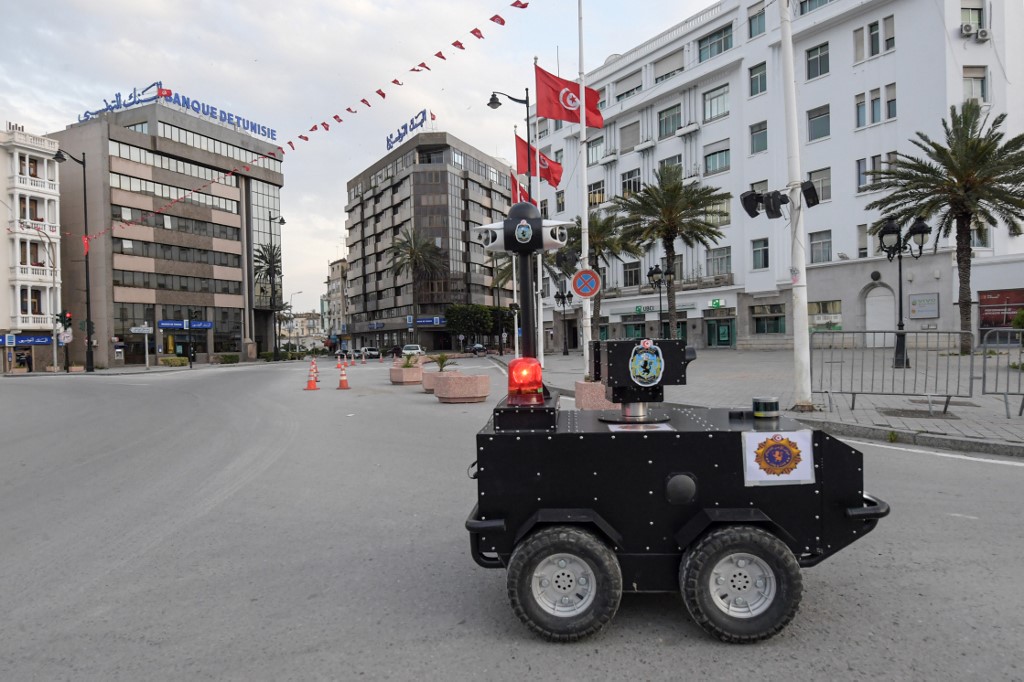A police robot patrols Tunis to enforce the Covid-19 lockdown on 1 April (AFP)