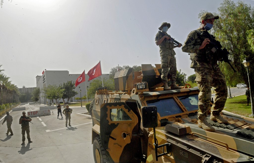 Tunisian military forces guard the area around parliament in Tunis on 26 July 2021 (AFP)
