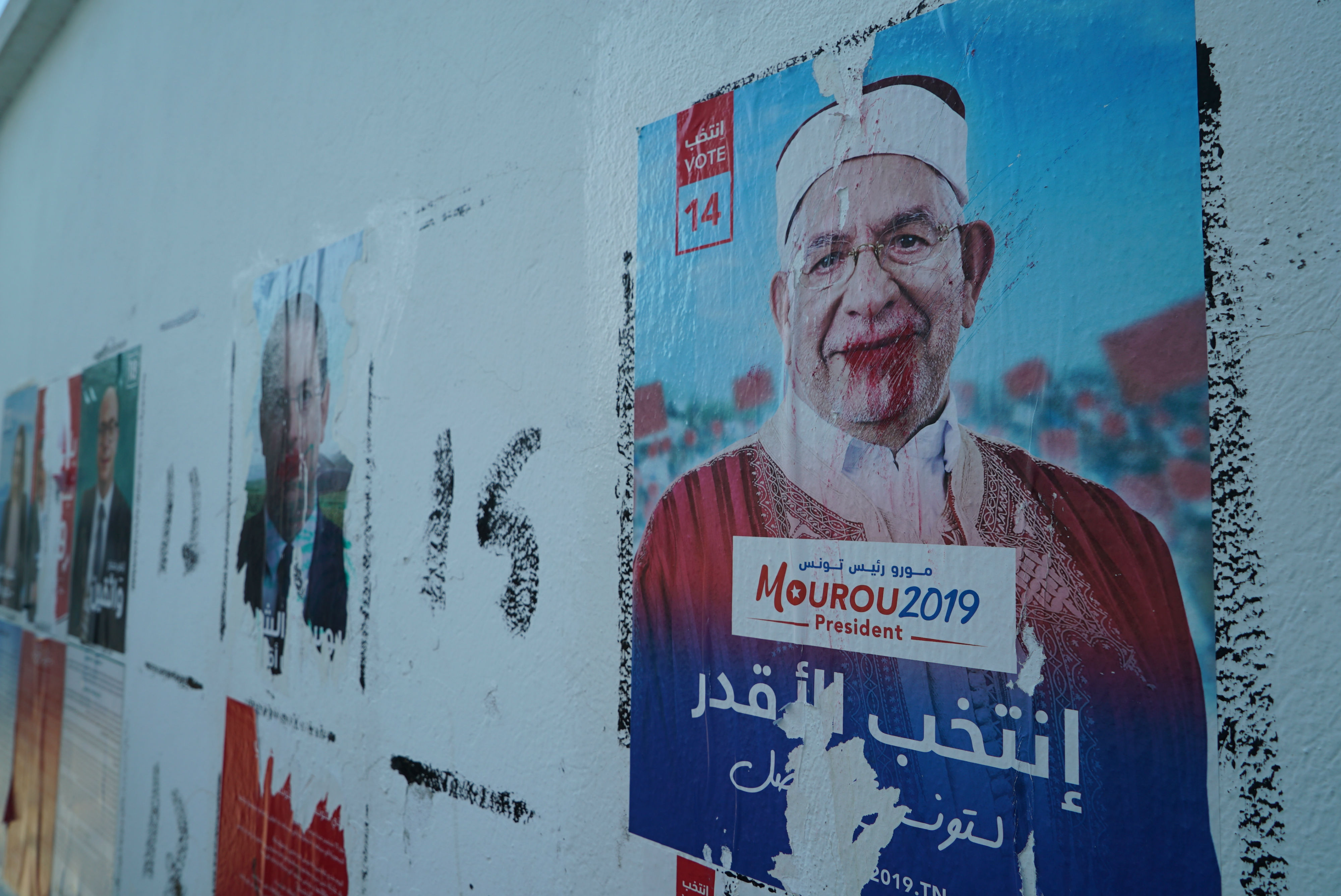 Some posters of the presidential candidates in the capital have been defaced (MEE/Faisal Edroos)