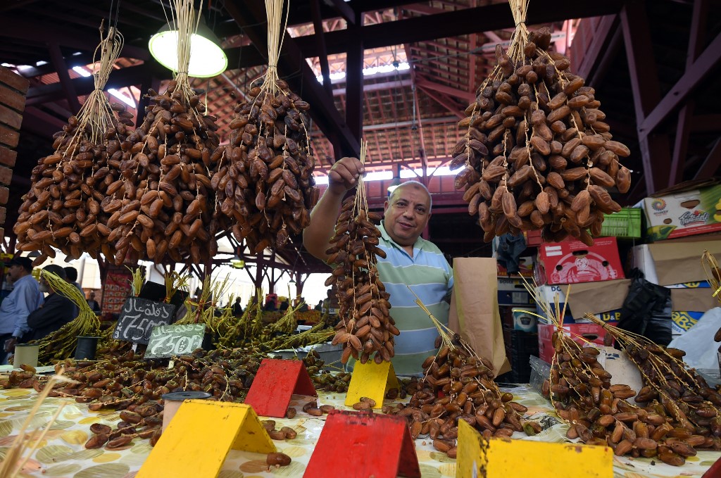 A vendor sells dates, mostly grown in southern Tunisia, at a market in the capital (AFP)