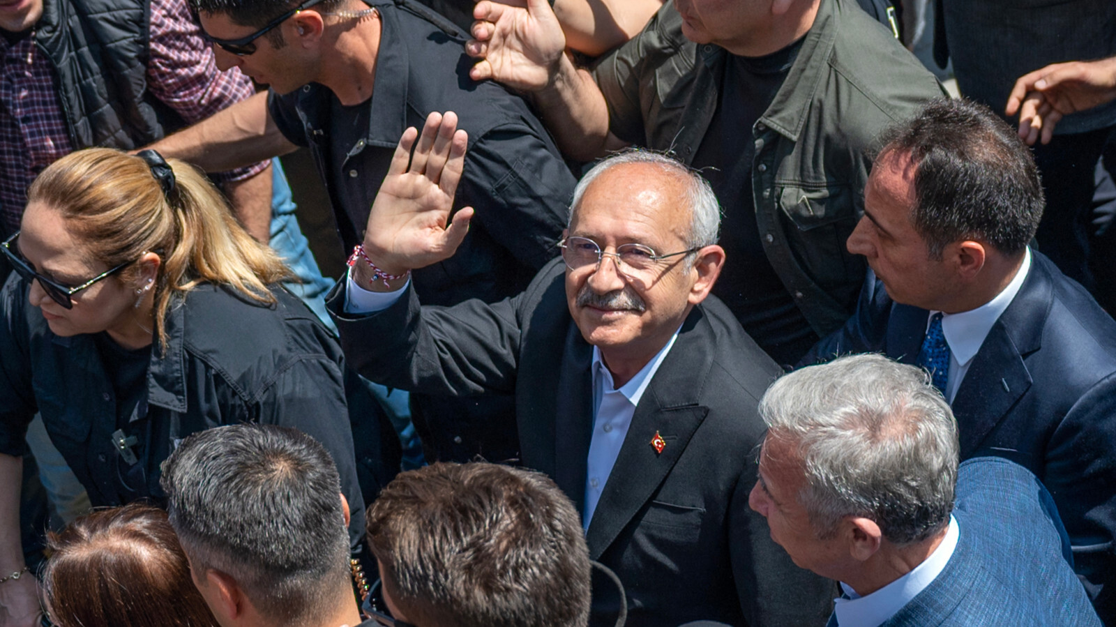 Presidential candidate Kemal Kilicdaroglu waves as he leaves after voting in the elections, in Ankara, Turkey, on May 14, 2023 (AFP)