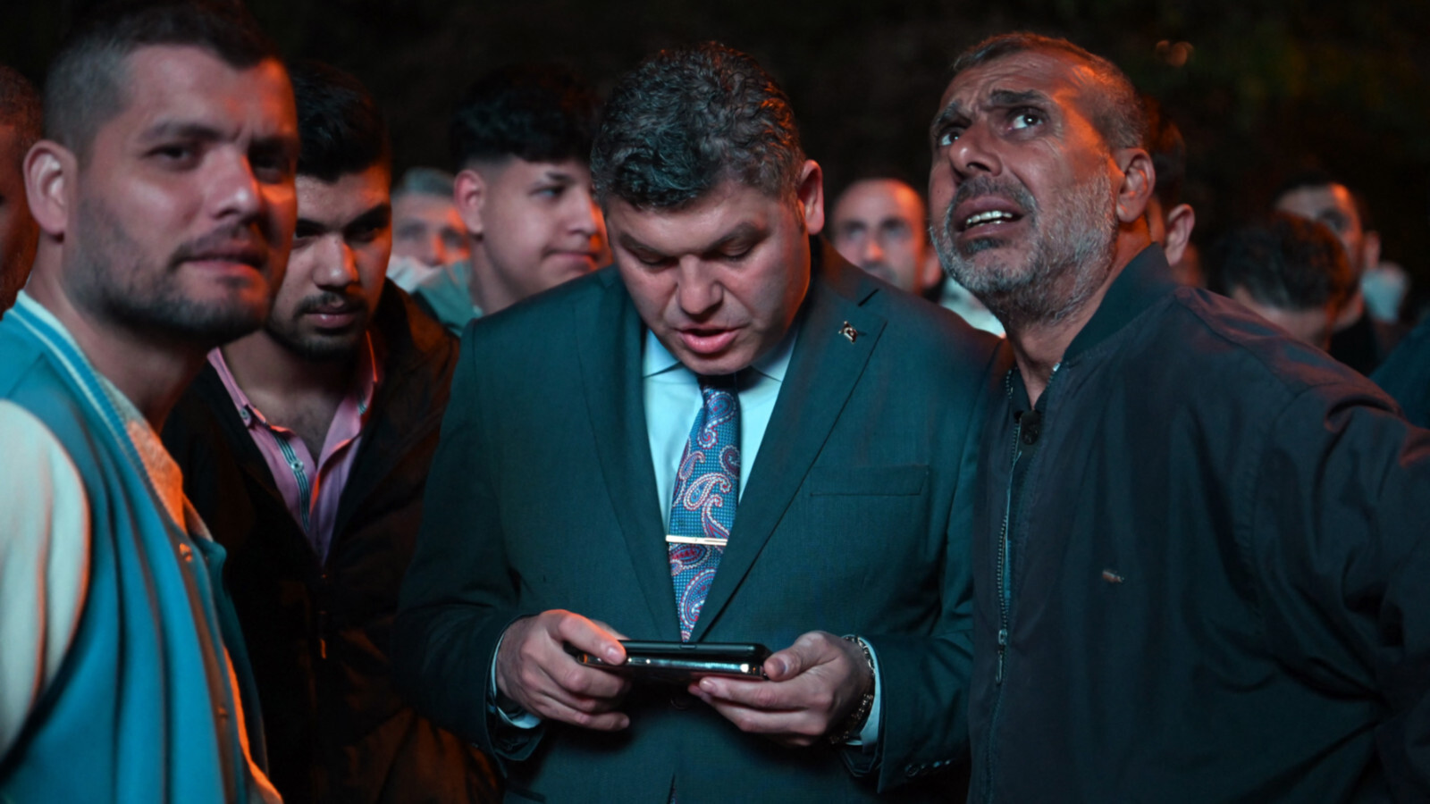 AKP supporters wait for news outside party HQ in Istanbul on 14 May 2023 (AFP)