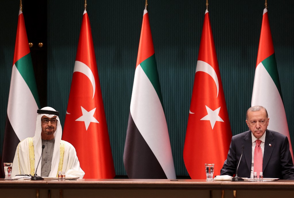 Erdogan and Abu Dhabi Crown Prince Mohammed bin Zayed sign agreements in Ankara on 24 November 2021 (AFP)