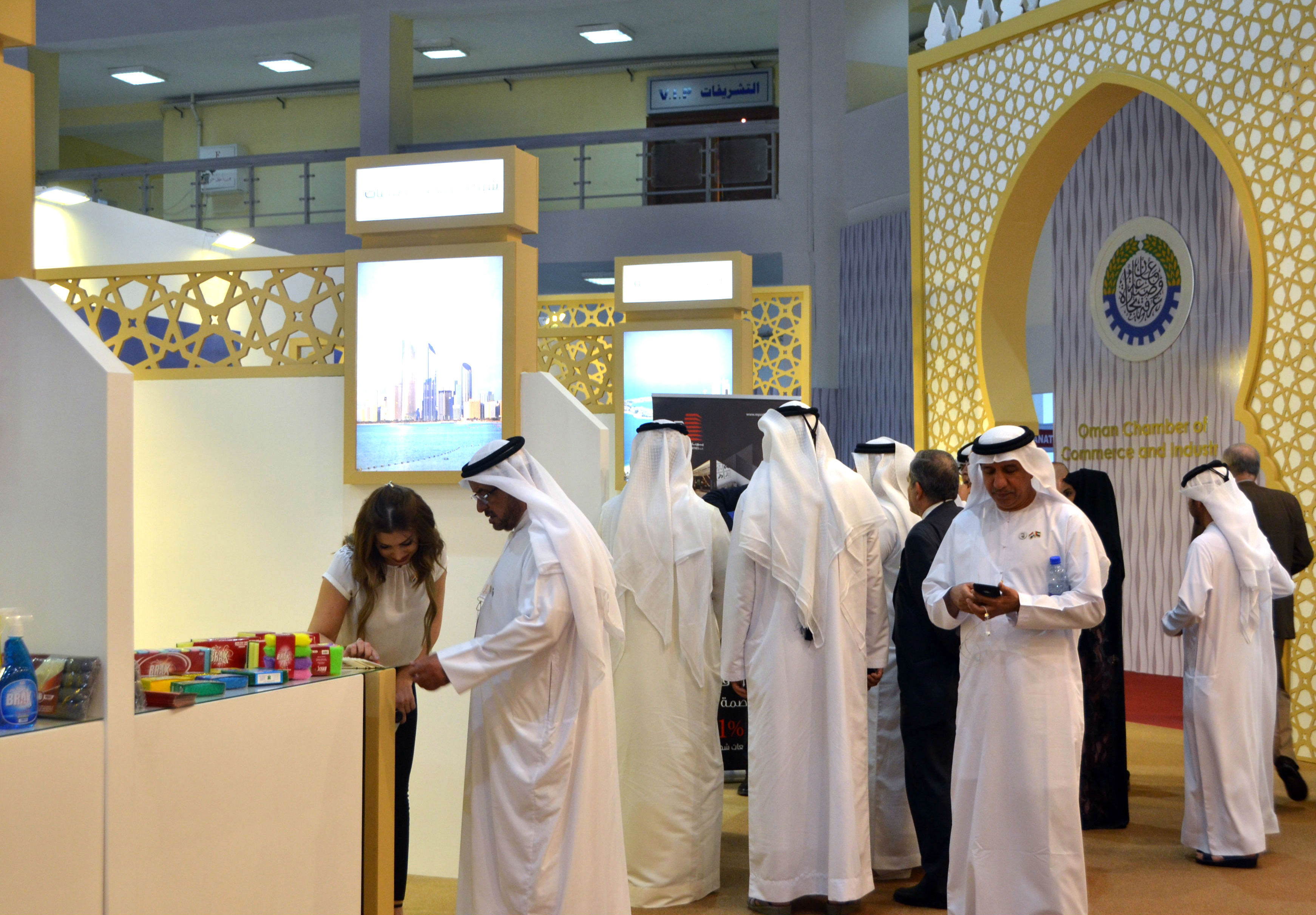 People inspect the stall of Emirati companies at the Damascus International Fair in the Syrian capital (AFP)