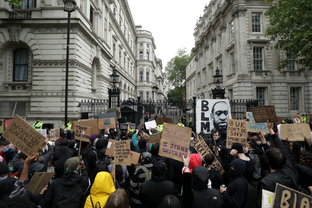 Protesters gather in central London after a demonstration outside the US embassy on 7 June in solidarity with the Black Lives Matter movement (AFP)