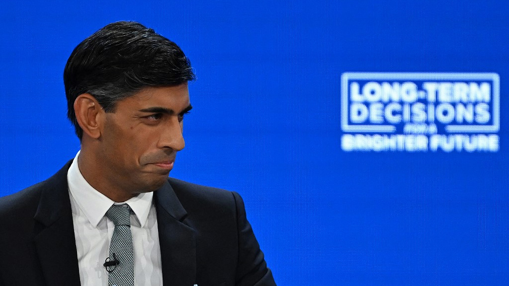 British Prime Minister Rishi Sunak addresses delegates at the annual Conservative Party conference in Manchester, northern England, on 4 October 2023 (AFP)