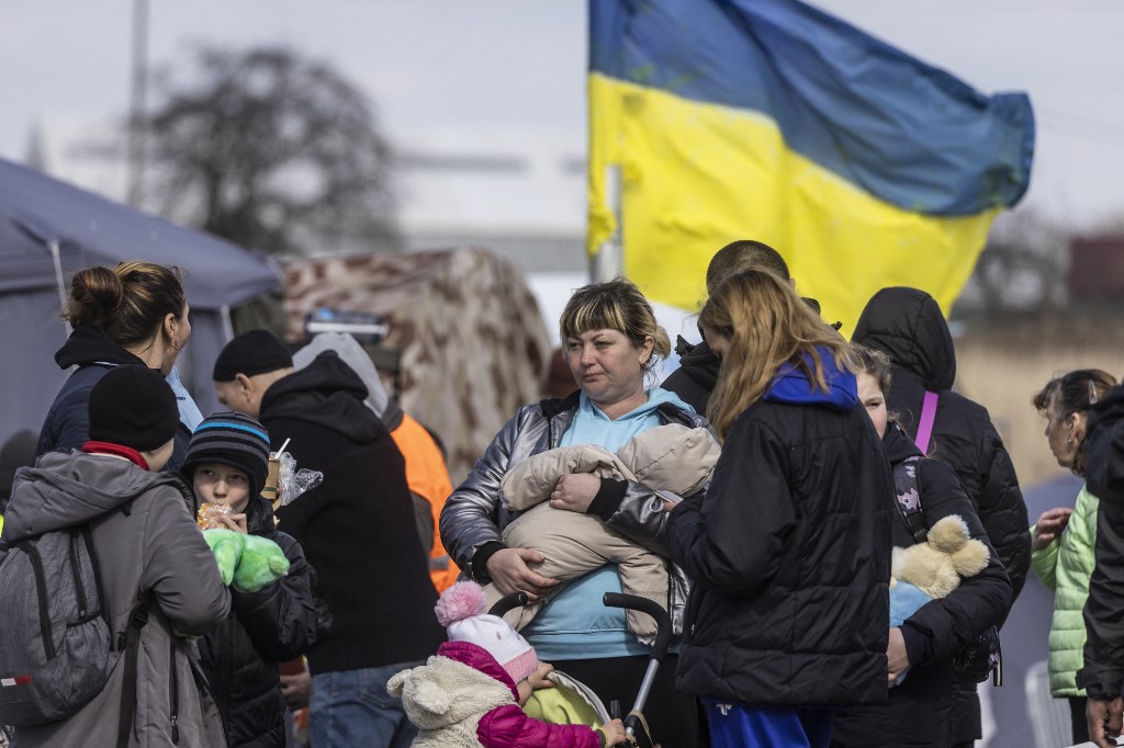 A family from Ukraine is seen on the Medyka border crossing, April 4, 2022.