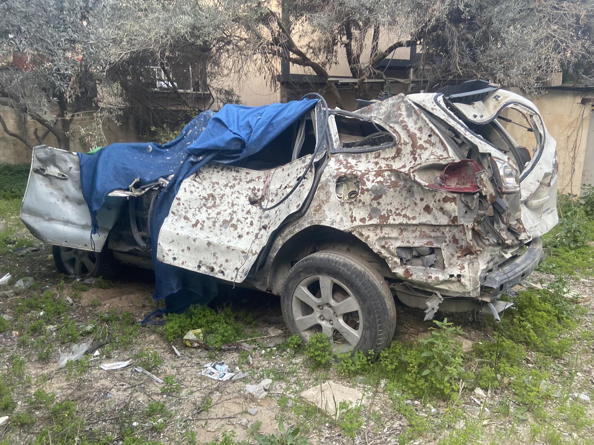 A destroyed Jeep belonging to the author's uncle, in which he was killed while protecting his four-year-old son on 14 October 2023 (Tarneem Hammad)