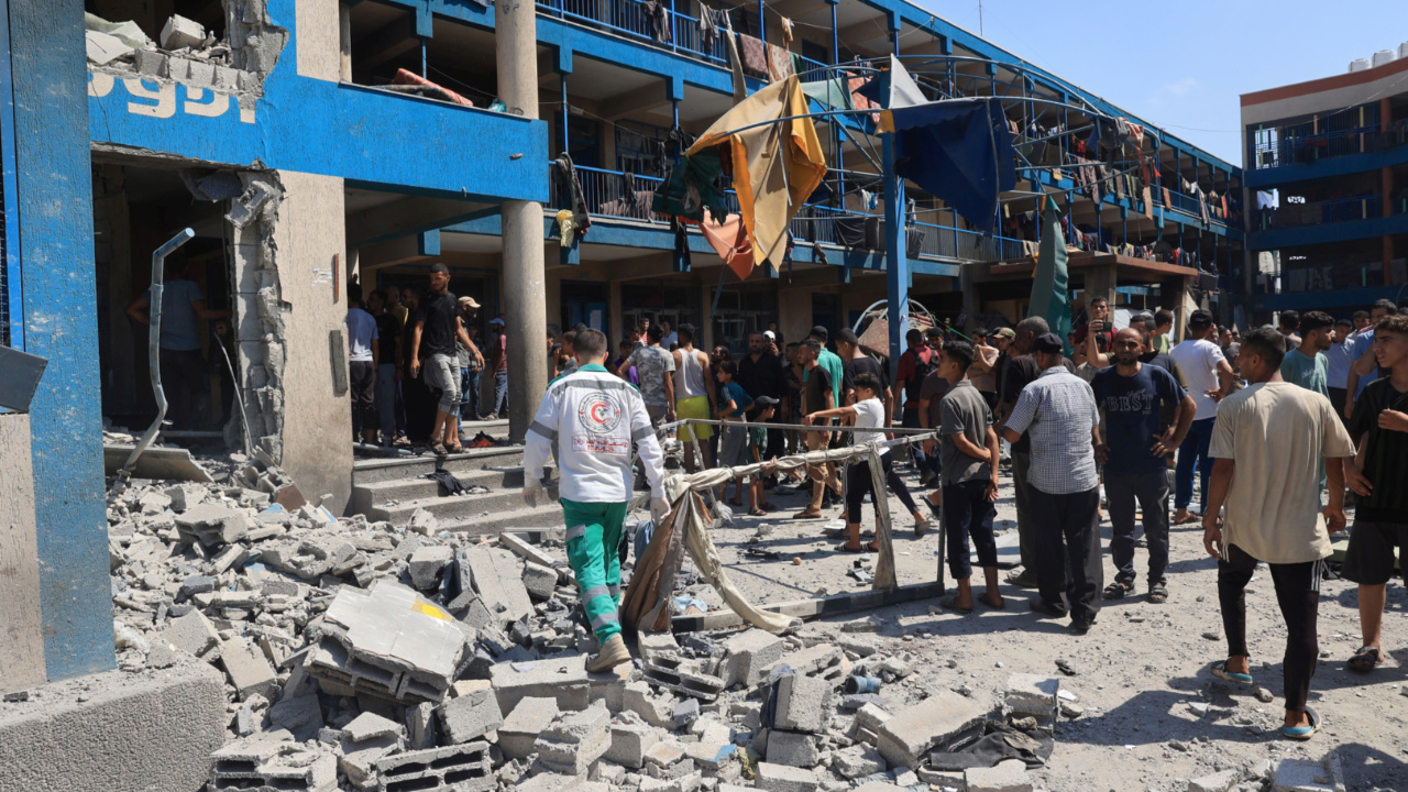 Palestinians assess the damage following a deadly Israeli strike on an Unrwa-run school in the Nuseirat refugee camp, central Gaza on 14 July, 2024 (Eyab Baba/AFP)