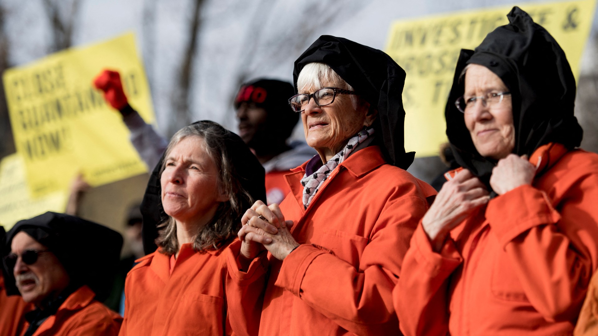 Activists protest the Guantanamo Bay detention camp during a rally in Lafayette Square outside the White House in Washington, DC on on 11 January 2018 (AFP)