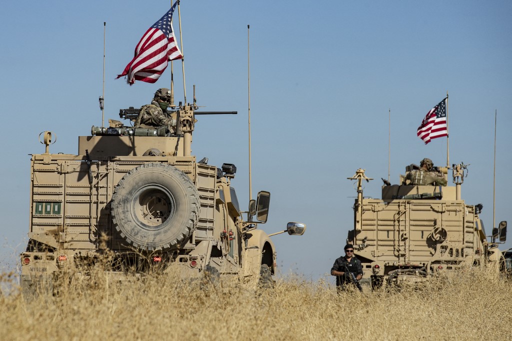 US military vehicles, part of a joint convoy with the Kurdish YPG, patrol northeastern Syria on 9 November 2019 (AFP)