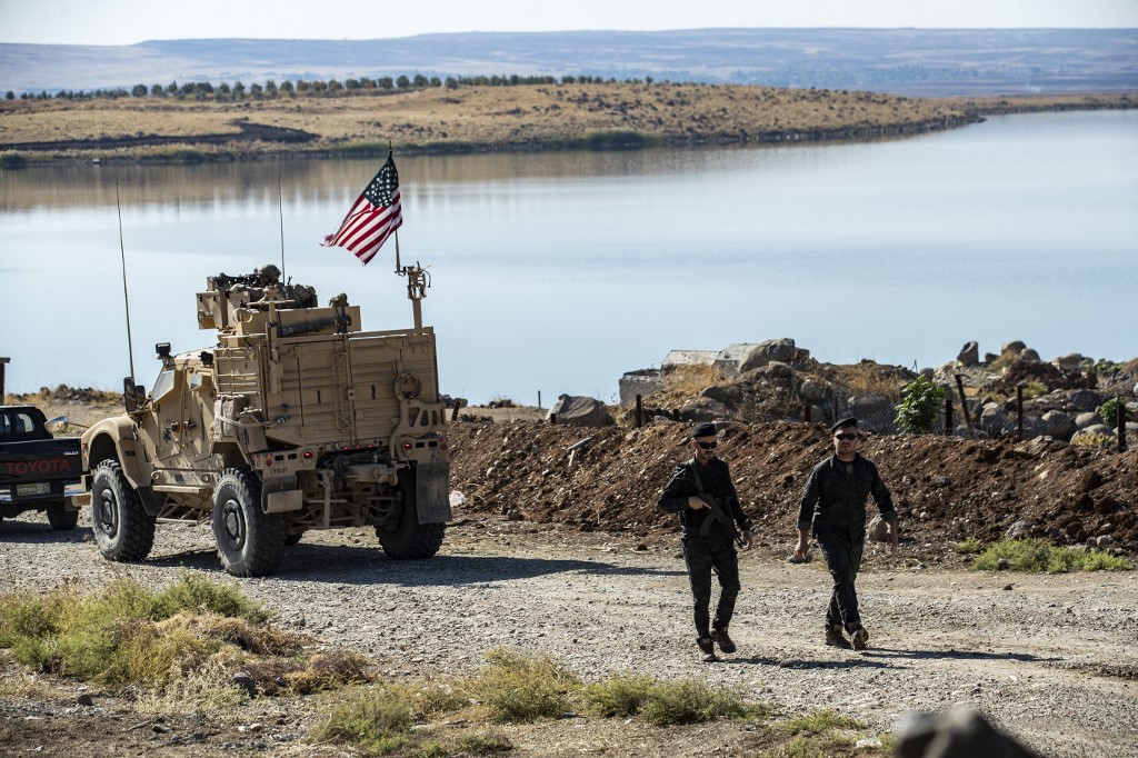 US military vehicles, part of a joint convoy with the YPG, patrol in the northeastern Syrian Hasakeh province in November 2019 (AFP)