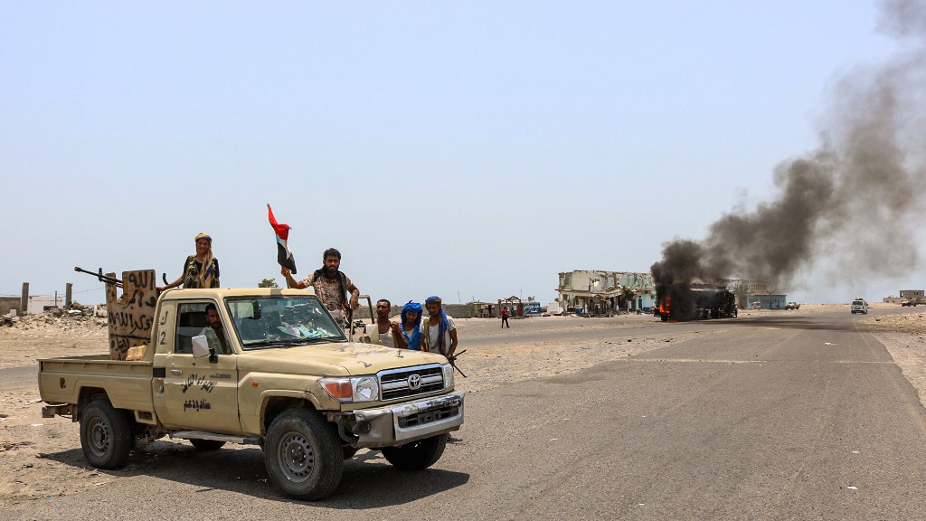 Fighters gather in southern Yemen on 30 August (AFP)