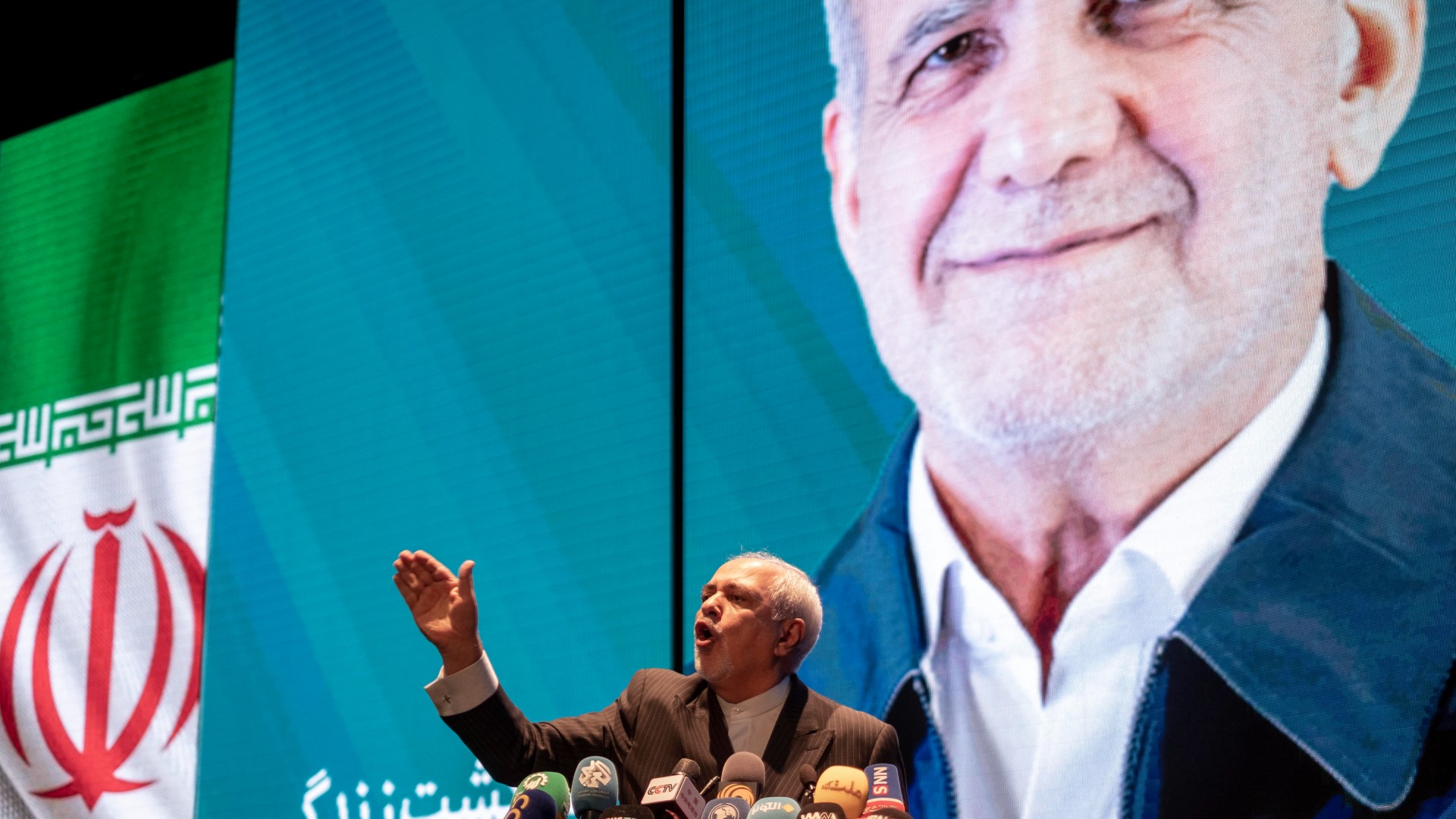 Mohammad Javad Zarif speaking to supporters of Masoud Pezeshkian during a rally at the Milad Tower concert hall in downtown Tehran, Iran, on 19 June (Reuters/Morteza Nikoubazl/NurPhoto)