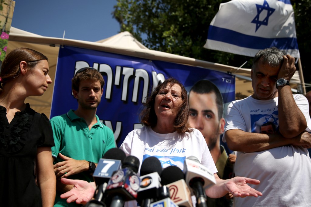 Zehava Shaul, mother of Oron Shaul, speaks to reporters (AFP)